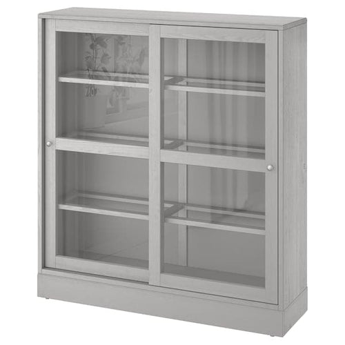HAVSTA - Glass-door cabinet with plinth, grey/clear glass, 121x37x134 cm