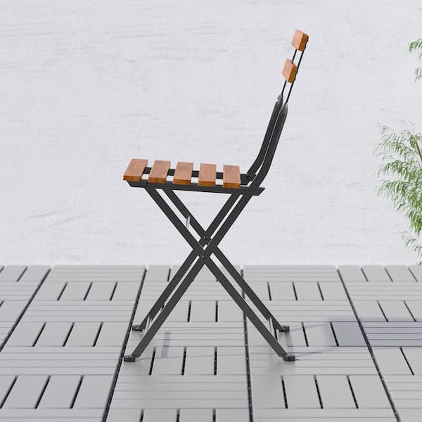 TÄRNÖ - Chair, outdoor, foldable black/light brown stained - best price from Maltashopper.com 90095428