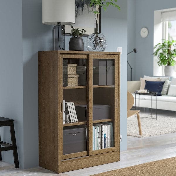 Ikea TONSTAD - Cabinet with sliding glass doors, brown stained oak veneer, 82x37x120 cm